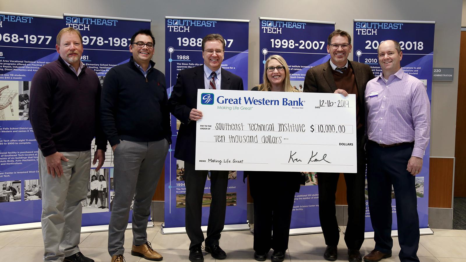 Great Western Bank officials hand donation check to Southeast Tech administrators