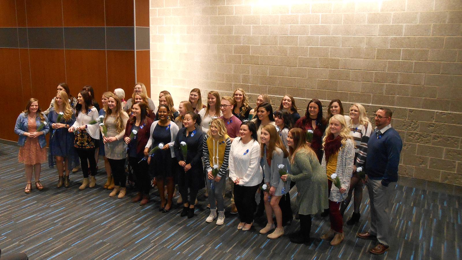 Group of LPN graduates receiving pins in HUB Auditorium