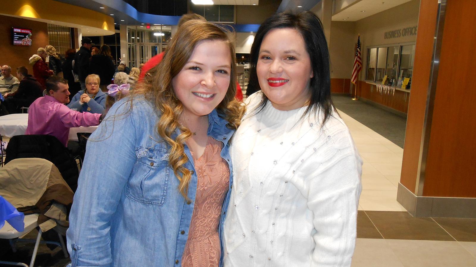 Two LPN students smiling at pinning reception