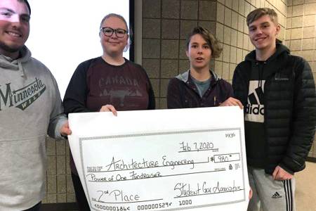 Architectural Engineering Technology students stand with donation check.