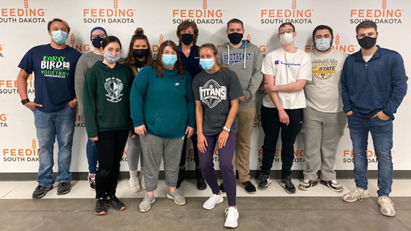 Business students volunteering with Feeding South Dakota