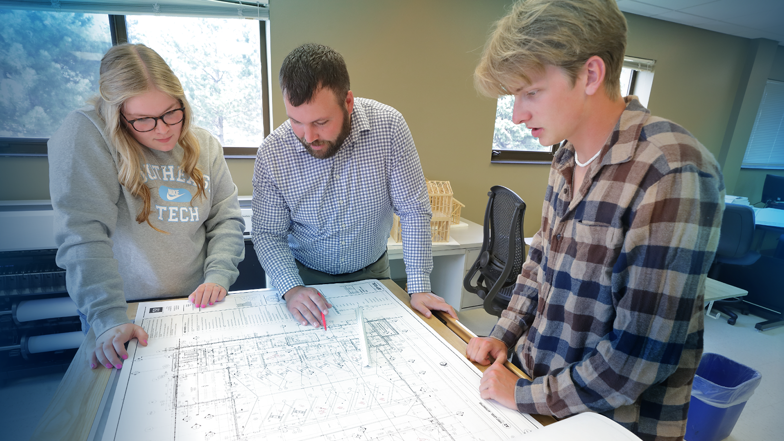 Instructor engaging with students in Architectural Program