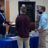 Students talking with employer - Engineering and Construction Management Career Fair