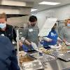 Volunteers from STC prepare to serve at The Banquet.