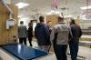 Ribbon cutting attendees touring the lab.