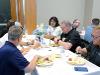 Attendees eat breakfast at signing day