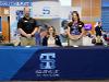 Welcome table at signing day with blue table cloth and admissions staff