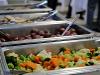 Buffet at lunch with veggies, potatoes in catering dishes