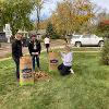 Students and staff volunteer to rake yards as part of Service to Community days. 