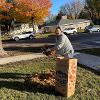 Students and staff volunteer to rake yards as part of Service to Community days. 