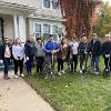 Students and staff volunteer to rake yards as part of Service to Community days. 