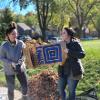 Students and staff volunteer to rake yards as part of Service to Community days. 