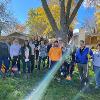 Students and staff volunteer to rake yards as part of Service to Community days. 