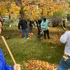 Students and staff volunteer to rake yards as part of Service to Community days. 