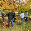 Students and staff volunteer to rake yards as part of Service to Community days. 