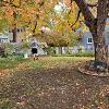 Students and staff volunteer to rake yards as part of Service to Community days. 