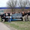 Graphics on a Dodge Charger utilized by the Law Enforcement program recognize the agency that provided them. 